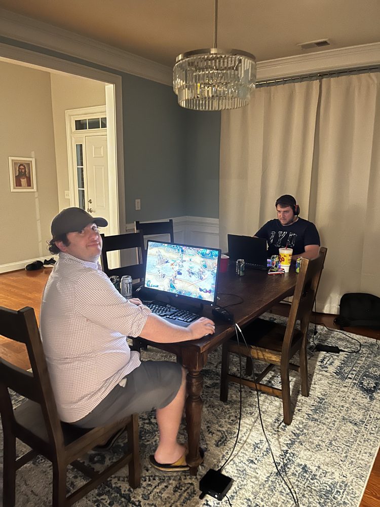 Two of the squad mid-game at the dining room table